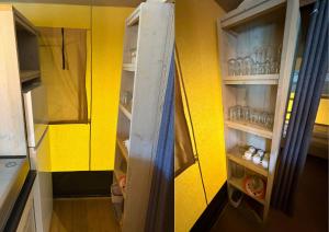 a refrigerator in a kitchen with a yellow wall at Safaritent Ranger Lodge in Kesteren +6 photos