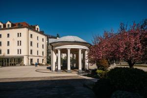 a gazebo in front of a white building at Grand Hotel Sava Superior in Rogaška Slatina
