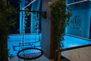 a swing in front of a building with plants at Apartamenty Katowice by Lantier - Basen & Gabinet SPA in Bytom +53 photos