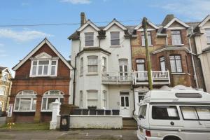 a white van parked in front of a house at Flat 4, 15 Ethelbert Square CT8 8SR in Westgate-on-Sea