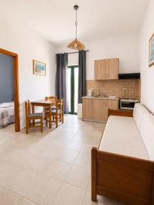 a living room with a couch and a table at 4Seasons Sfakia in Hora Sfakion