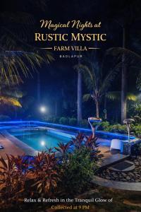 a sign for a resort with a swimming pool at night at Rustic Farm Villa in Chinchavli +8 photos