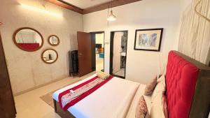 a bedroom with a large bed in a room at Rustic Farm Villa in Chinchavli
