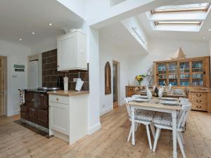 a kitchen and dining room with a table and chairs at Stourcliffe House in Bournemouth