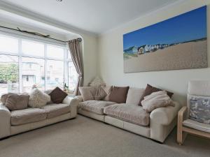 a living room with two couches and a large window at Stourcliffe House in Bournemouth