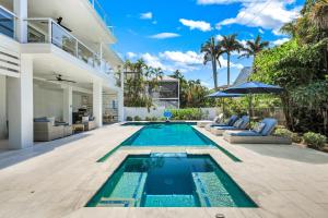 a swimming pool in the backyard of a house at Cabana Blu in Captiva