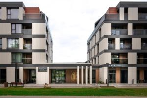 a building with two tall buildings at Polanica Park in Polanica-Zdrój