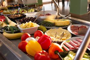 a buffet line with many different types of food at Alyssium in Benitses