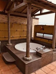 a bathroom with a bath tub in a building at バリアンリゾート山口BarianResort Yamaguchi in Sanyoonoda +51 photos