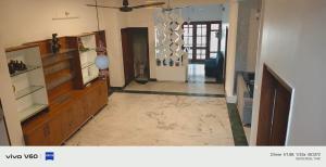 a hallway of a house with a room with a door at Tranquil Nature Resort in Rāipur