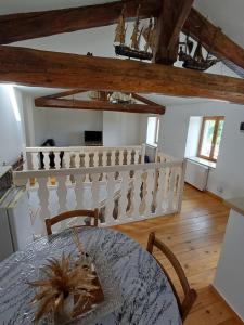 a kitchen and dining room with a table and chairs at Le Trois Mâts 5 in Thiers