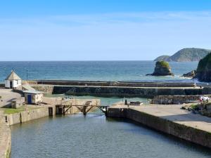 a view of a body of water with a pier at Gwelmor in Charlestown
