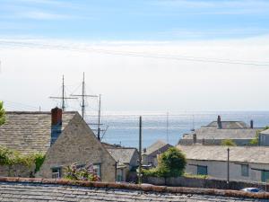 a group of houses with the ocean in the background at Gwelmor in Charlestown