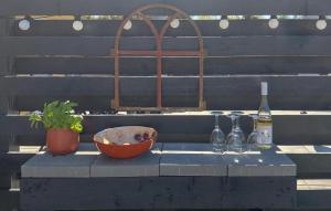 a table with wine glasses and a bowl on it at 2 Bedroom Lovely Apartment In Gørlev in Gørlev