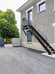 a staircase on the side of a building at Une pause au pied des Pyrénées in Asson