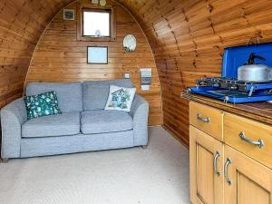 a living room with a couch in a room at Woodpecker Hollow - Uk45980 in Ebchester