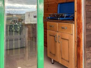 a kitchen with a stove top on a counter at Woodpecker Hollow - Uk45980 in Ebchester