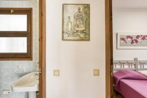 a bathroom with a sink and a mirror at Bahia Studio in Empuriabrava +12 photos