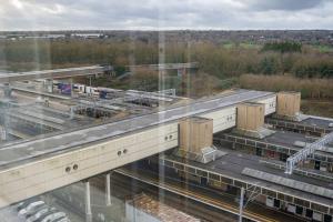 an aerial view of a building with a train station at Station Gold Leaf - Gym - Games Room - MK in Milton Keynes