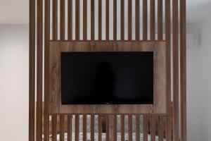 a flat screen tv on a wooden wall at Studio Rimini 523, Kotor in Kotor