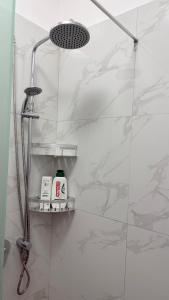 a bathroom with a shower with a glass door at Fori Vodo in Divjakë