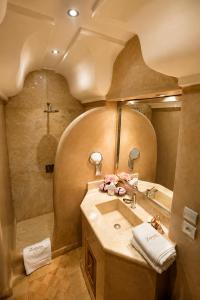 a bathroom with a sink and a shower at Riad Zamzam & Spa in Marrakesh +70 photos