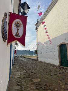 a flag hanging on the side of a building at Pousada santa rita in Paraty