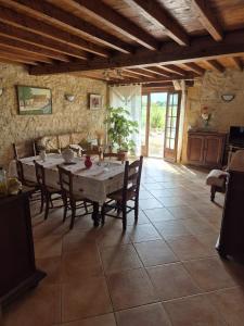 a large dining room with a table and chairs at gites de la Vaysse in Vergt-de-Biron