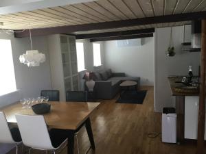 a living room with a table and a couch at Det Bette Hus in Fladbjerg