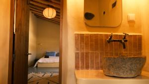 a bathroom with a sink with a faucet at Helder Farm Studios in São Teotónio +110 photos