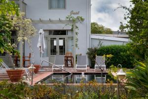 a house with a patio and a pool at Montagu Country Hotel in Montagu