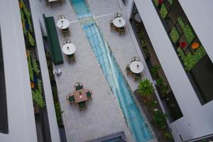 an overhead view of a swimming pool in a building at سنود النرجس Snood Al Narjis in Riyadh