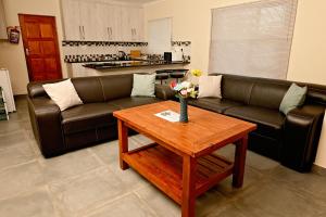 a living room with a couch and a coffee table at On 47a in Kimberley