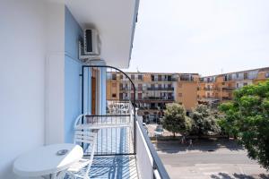 a balcony with a view of a city at Prestige House 7 in Scalea