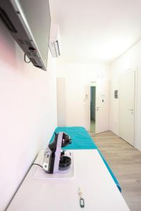 a hospital room with a bed with a machine on it at Prestige House 7 in Scalea