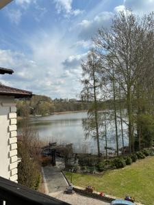 a view of a lake from a house at Zacisze Zbiczno in Zbiczno