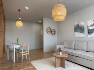 a living room with a couch and a table at Türi Cozy Apartment in Türi