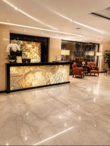 a lobby with a reception desk in a hotel at Laodikya Hotel in Denizli