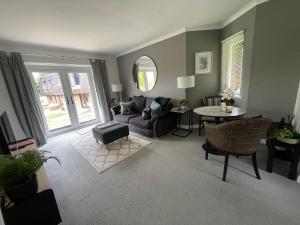 a living room with a couch and a table at Gleneagles Rental in Auchterarder