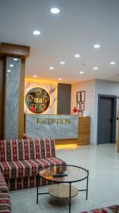 a lobby with a couch and a coffee table at 53 BRN hotel in Ardeşen