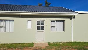 a white house with a black roof at Aqua Farm - Unit 3 in Teba