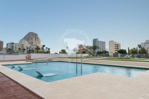 a swimming pool in the middle of a city at Silver Tower 7A in Ifach