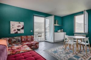 a living room with a couch and a table at Villa Amatissima by Villa Porta Collection in Brezzo