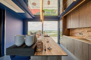 a kitchen with a long table with bowls and spoons at Guest House Valea Morilor in Chişinău