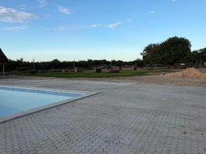 a swimming pool in the middle of a road at Watupa Chalets in Rundu