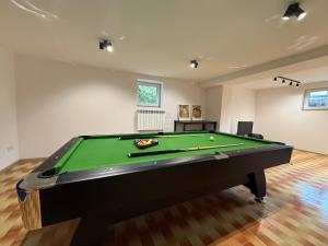 a living room with a pool table in a room at House Managers - Vintage Sopot in Sopot
