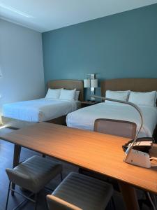 a room with two beds and a desk with a table at Element by Marriott Sedona in Sedona +44 photos