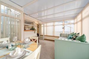 a dining room with a table and a couch at 2 Bed in Dalrymple oc-b40270 in Dalrymple
