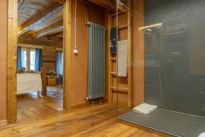 a glass shower in a room with a bedroom at Ristoro la Crosetta in Caneva +48 photos