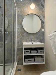 a bathroom with a sink and a mirror at Cabo de Sagres -1 bedroom apartment in Sagres +31 photos